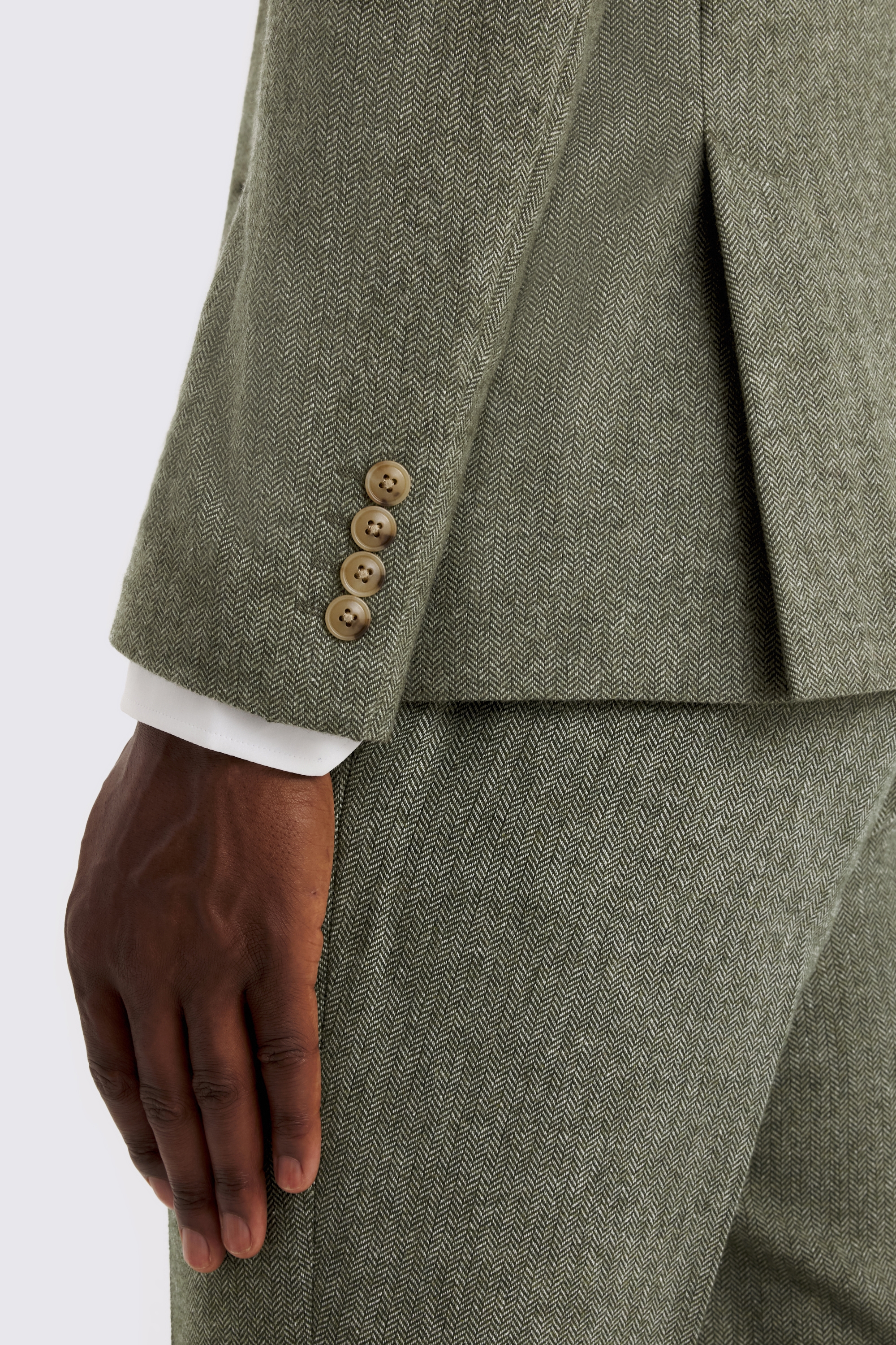 green herringbone tweed suit