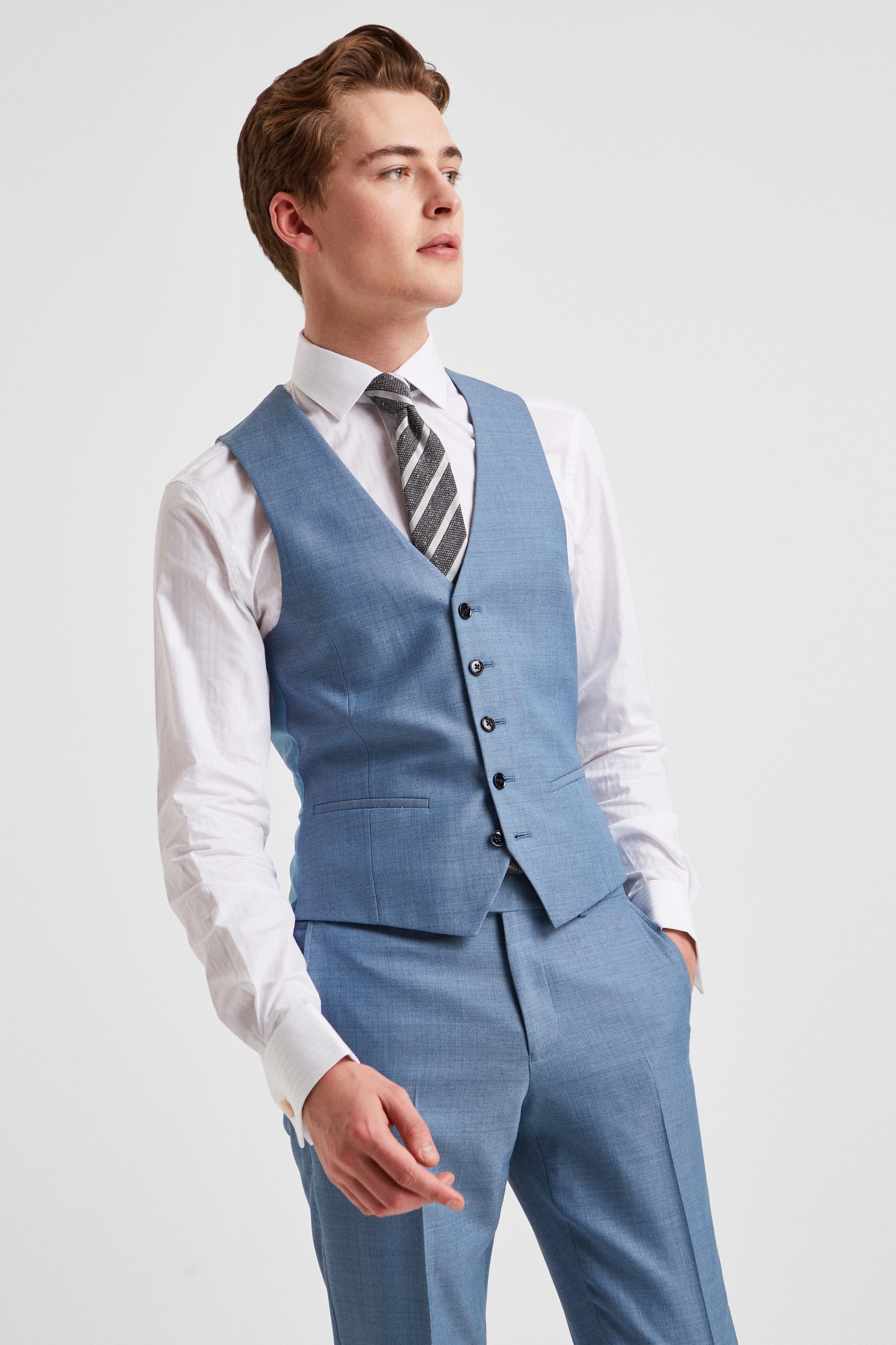 This slim fit navy blue suit with a grey waistcoat is a goto outfit for  almost any occasion Pr  Blue suit grey waistcoat Wedding suits men  grey Navy blue suit